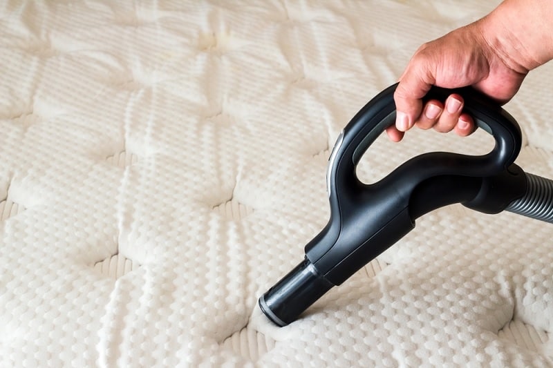 Vacuuming a mattress