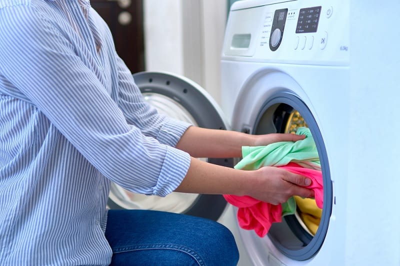 Taking laundry out of drum