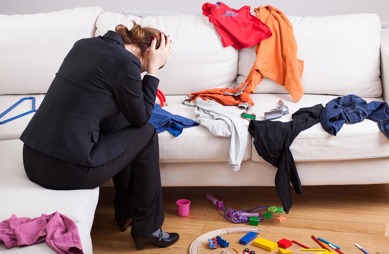 Unhappy woman in messy home