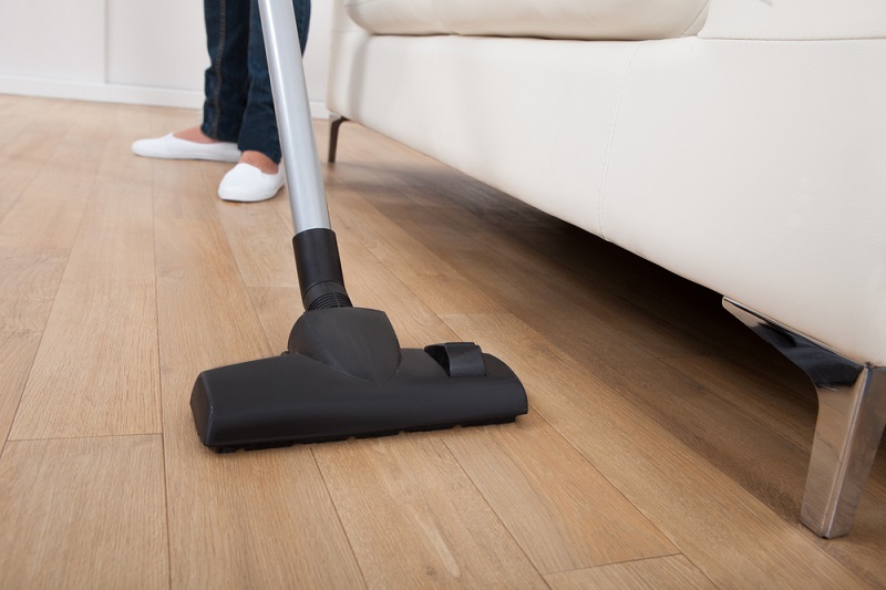 Vacuuming a wooden floor