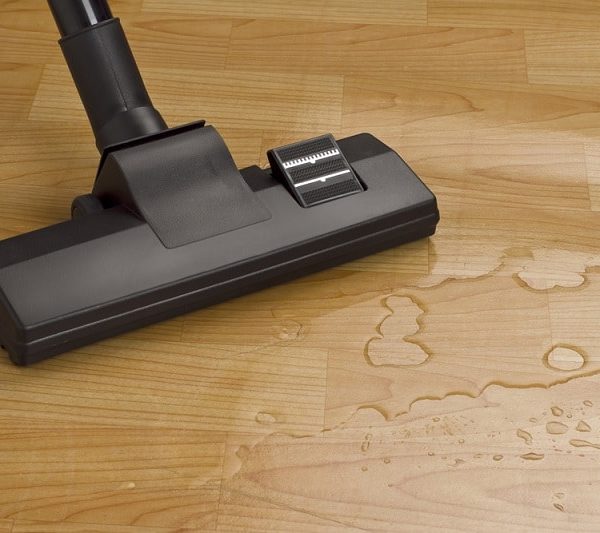 Vacuum cleaner with water on floor
