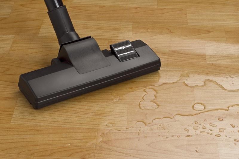 Vacuum cleaner with water on floor