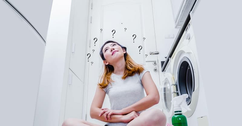 Woman thinking in laundry room