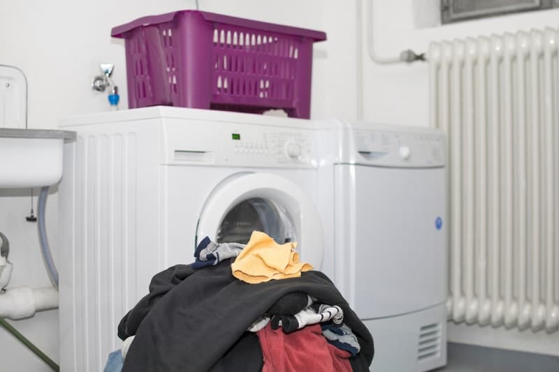 Tumble Dryer With Pile of Washing