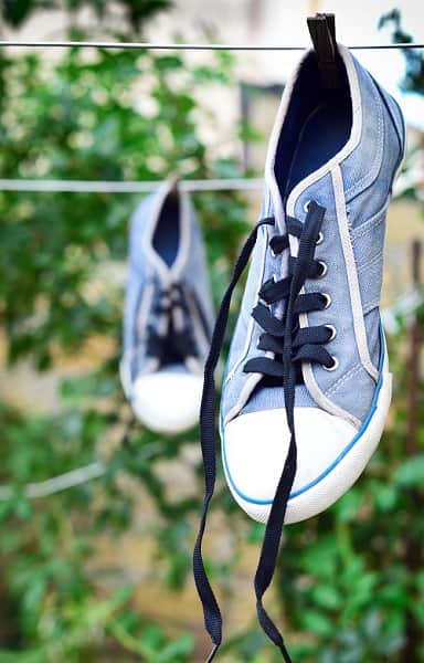 Pair of trainers drying outside on a washing line