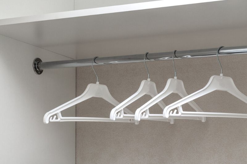 Empty Wardrobe with Coat Hangers