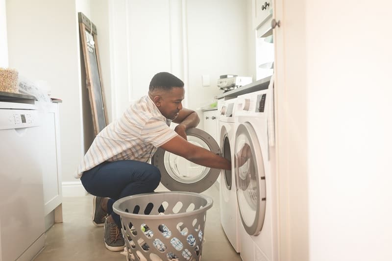 Man using washing machine