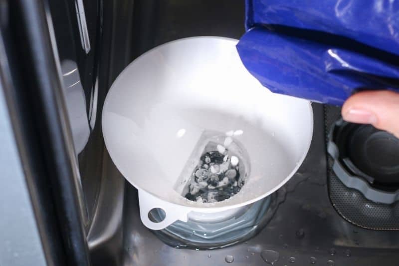 Pouring Dishwasher Salt