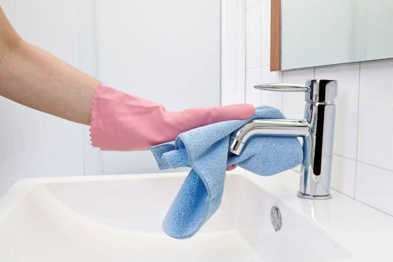 Wiping Chrome Faucet with Microfiber Cloth