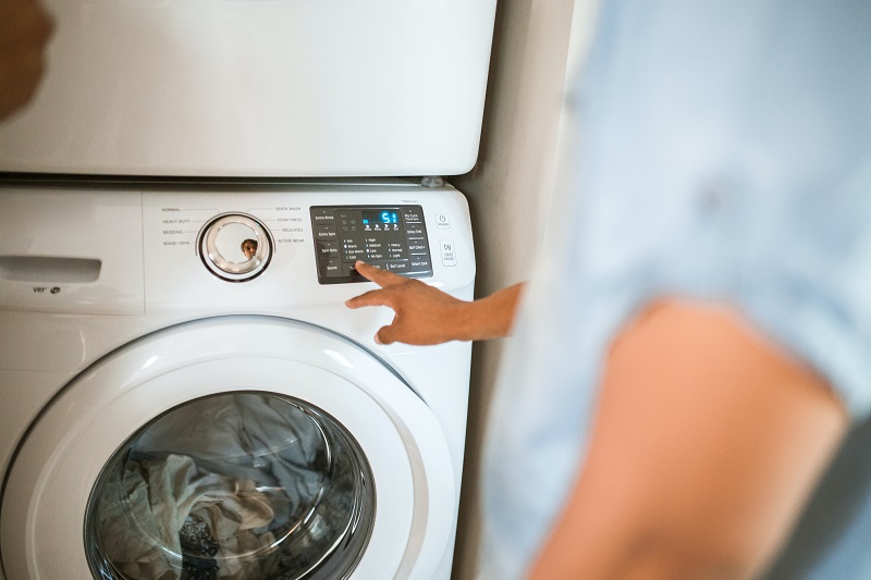 using washing machine to clean clothes