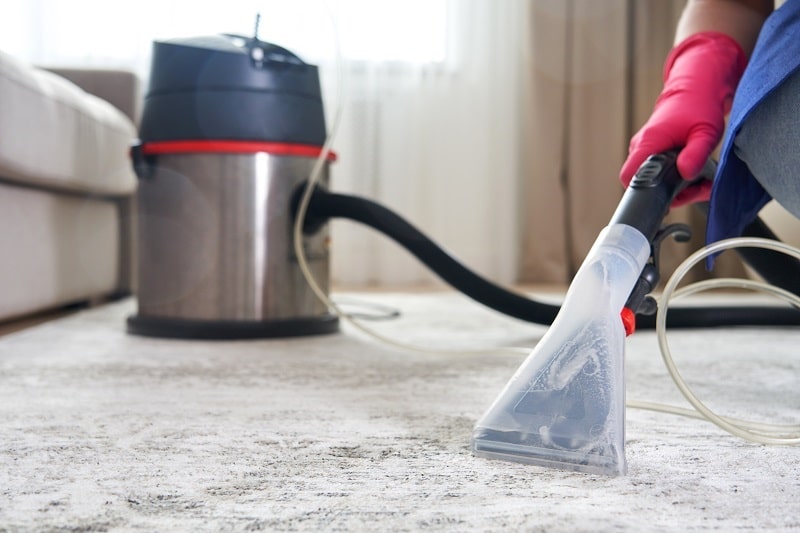 using carpet cleaner in living room