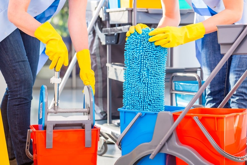 women mopping the floor