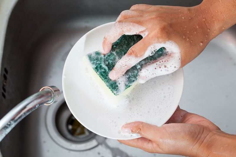 Washing dishes with washing up liquid