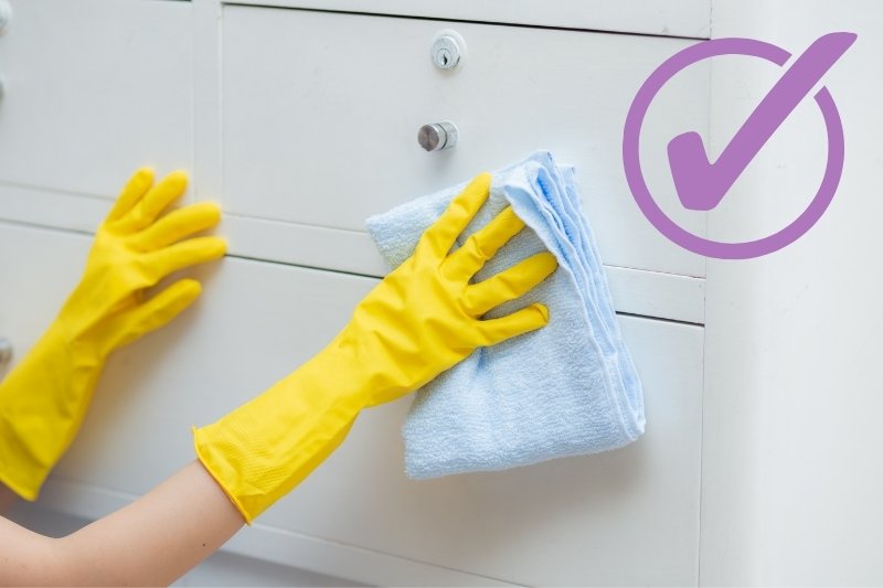 clean high-gloss cabinets regularly with microfiber cloth