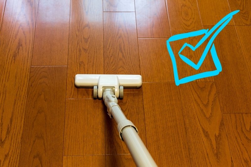 clean solid wood floor with vacuum
