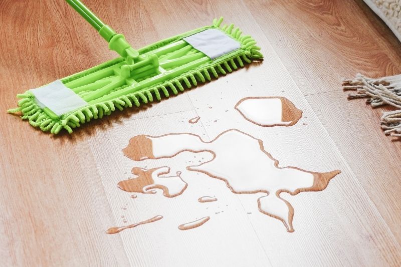 removing spills on wood floor immediately