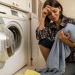 Woman next to washing machine