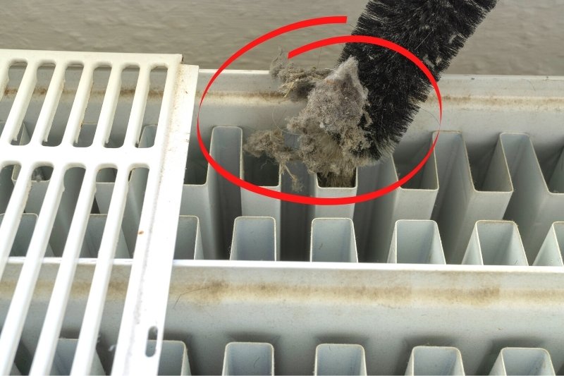 cleaning radiator with radiator brush