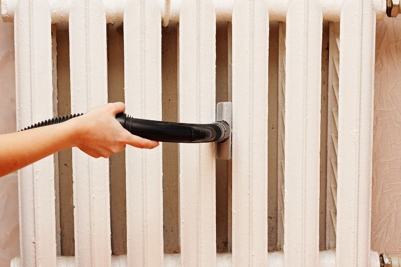 cleaning radiator with vacuum cleaner