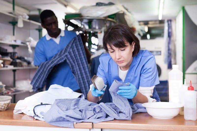 pre-treating clothes in dry cleaning