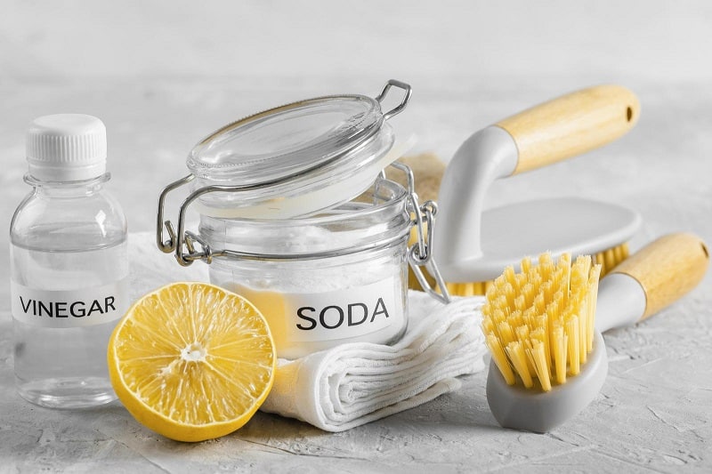 Lemon vinegar bicarbonate of soda and cleaning tools