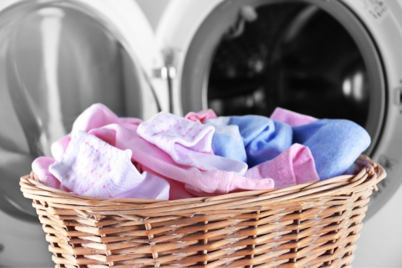 baby clothes and washing machine