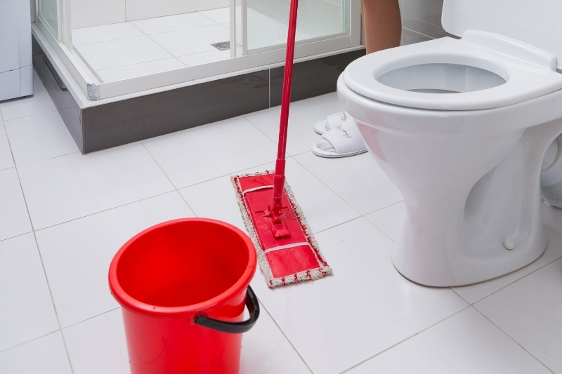 mopping bathroom floor