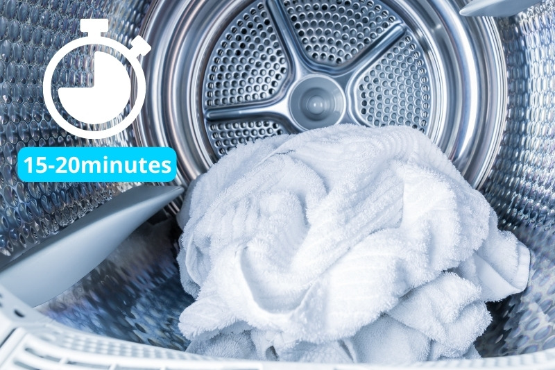 adding dry towel in the dryer