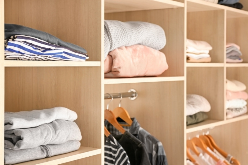 folded clothes in closet