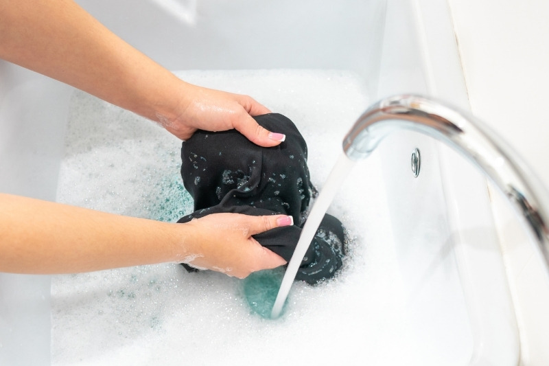 hand washing black clothes