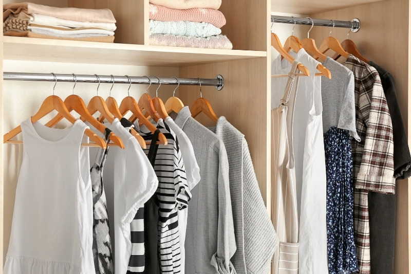 hanging clothes in the closet