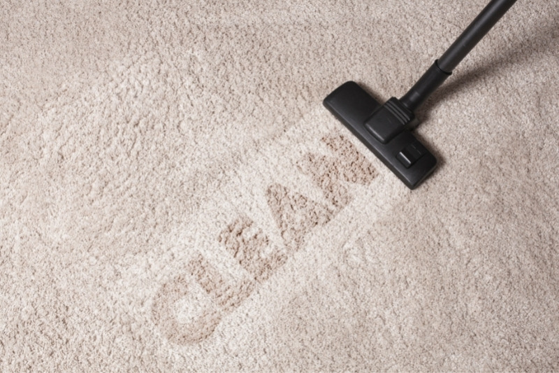 cleaning carpet with vacuum
