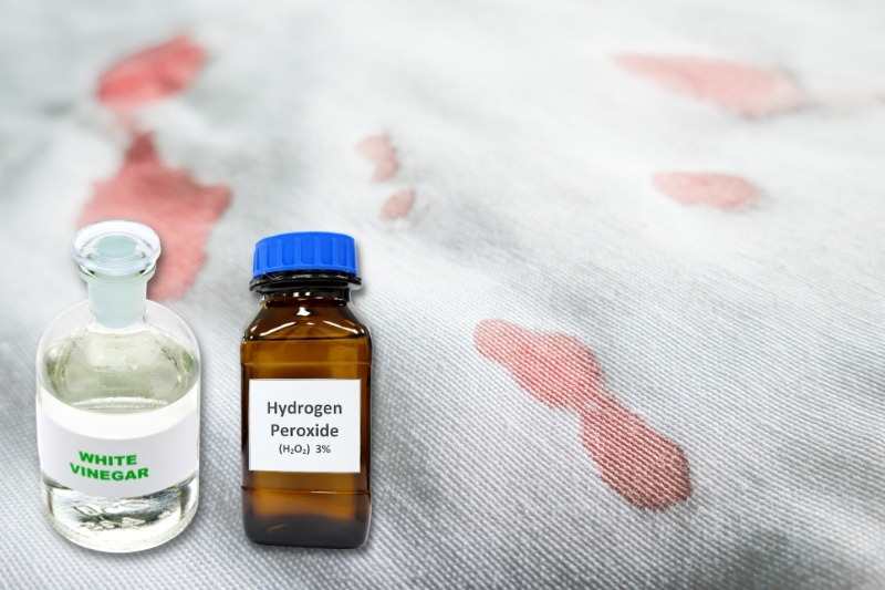 using vinegar or hydrogen perozide for blood stain