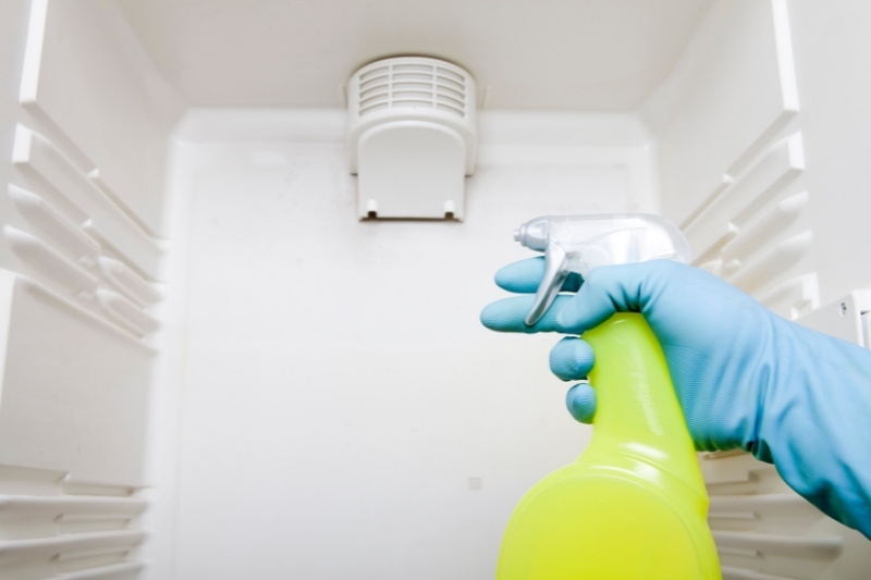 cleaning inside of fridge