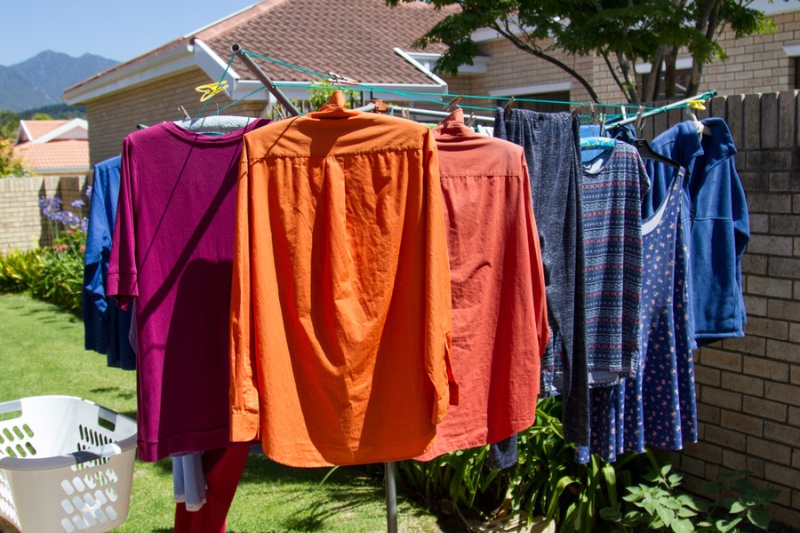 drying clothes in rotary washing line