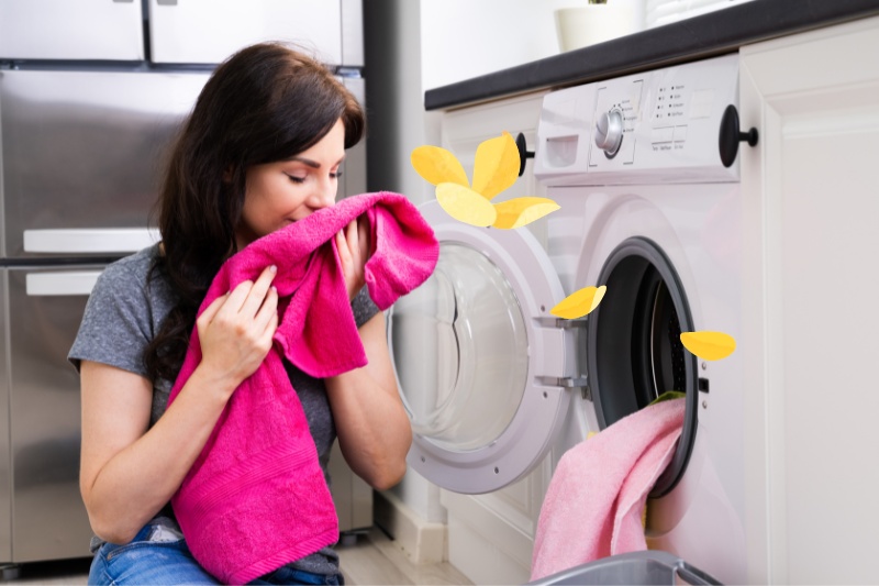 woman smelling newly-washed clothes