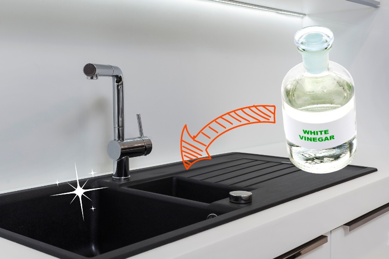 clean black composite sink with white vinegar