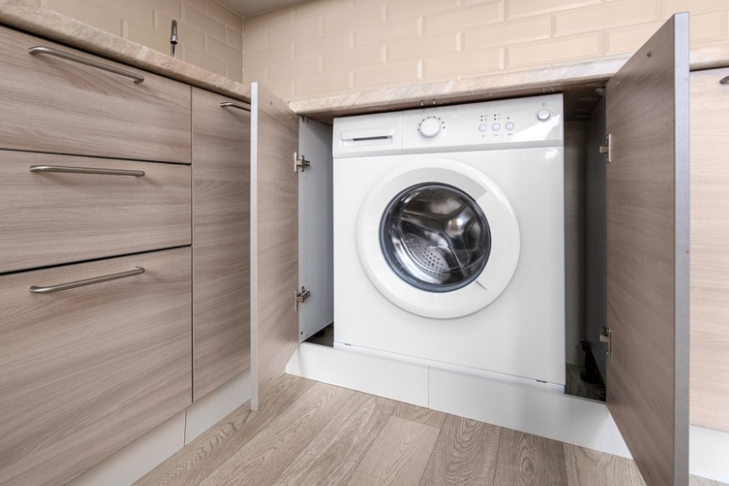 washing machine in a cupboard