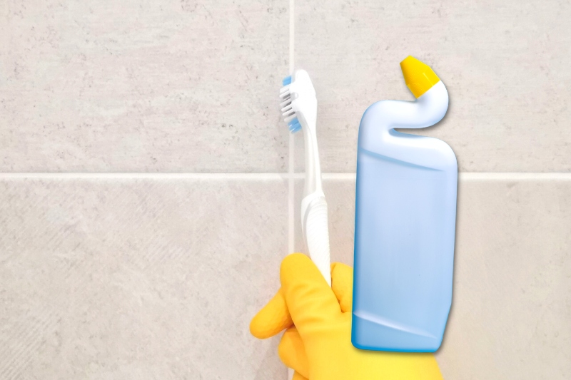 clean grout with Toilet Bowl Cleaner and brush