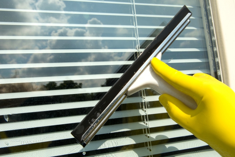 clean window with squeegee