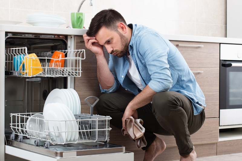 man problematic with dishwasher