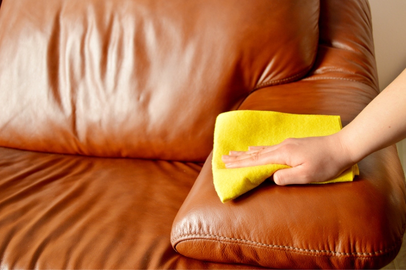 hand cleaning leather sofa