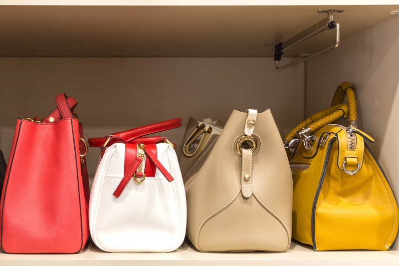 leather handbags in closet