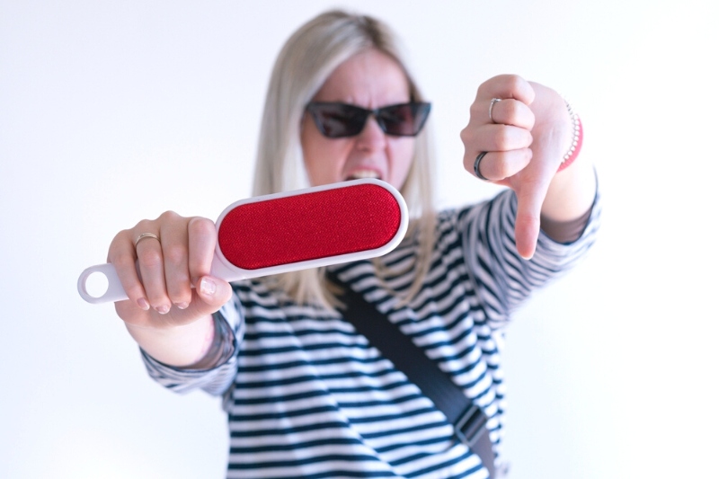 woman with thumbs down for lint brush