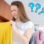 woman smells laundry after drying indoors