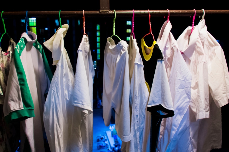 hanging clothes at night at the balcony