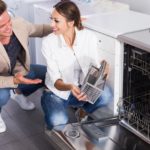 man and woman buying dishwasher