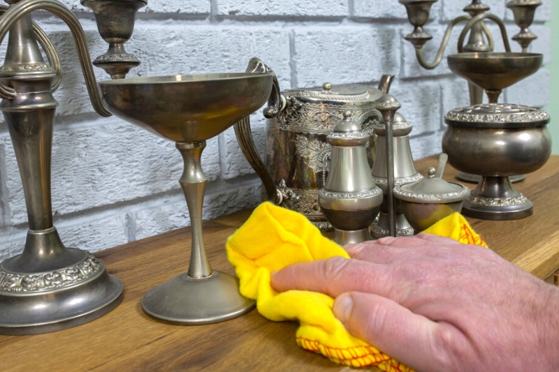 wiping pewter ornaments with microfibre cloth
