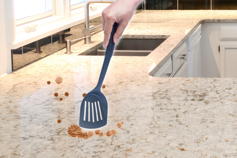 clean quartz countertop using plastic spatula