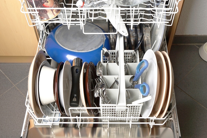 dirty dishes and pan in the dishwasher
